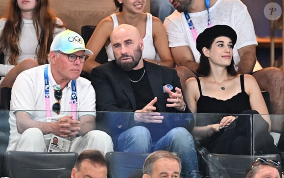 Mais celles des épreuves masculines du cheval d'arçons et du sol. La star américaine était accompagnée de sa fille Ella qui s'est distinguée par son joli look.
John Travolta et sa fille Ella Bleu assistent aux épreuves de gymnastique lors des Jeux Olympiques de Paris2024 (JO) le 3 aout 2024. © Perusseau-Jacovides-Bestimage 