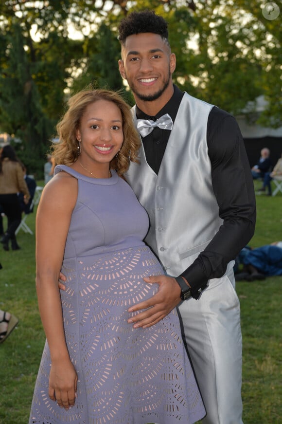 Exclusif - Tony Yoka et sa comapgne Estelle Mossely (enceinte, habillée par Christophe Guillarmé) - Les célébrités lors grand concert de l'Orchestre National de France au Champs de Mars présenté par S. Bern sur France 2 pour célébrer la Fête Nationale à Paris le 14 juillet 2017 © Giancarlo Gorassini / Pierre Perusseau / Veeren / Bestimage 