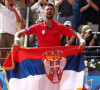 Le Serbe Novak Djokovic célèbre sa victoire après avoir remporté la médaille d'or lors de son match de finale du simple messieurs contre l'Espagnol Carlos Alcaraz à Roland Garros lors de la neuvième journée des Jeux Olympiques de Paris, le dimanche 04 août 2024.