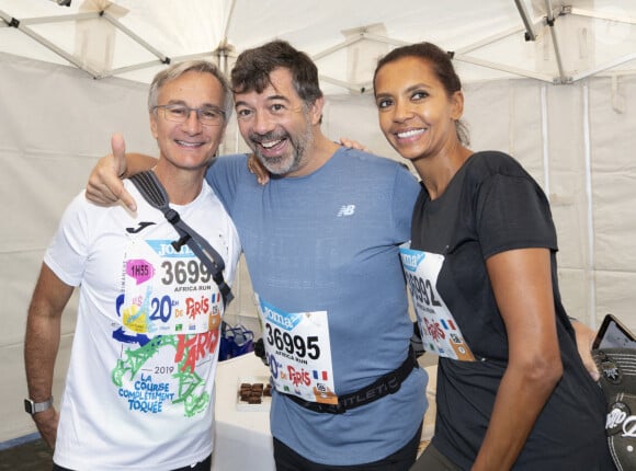 Laurent Petitguillaume, Stephane Plaza et Karine Le Marchand lors des 20 kilomètres de Paris, une course sur route de 20 kilomètres dont le départ est donné au Pont d'Iena au pied de la Tour Eiffel à Paris, France, le 13 octobre 2019. Photo par Loic Baratoux/ABACAPRESS.COM