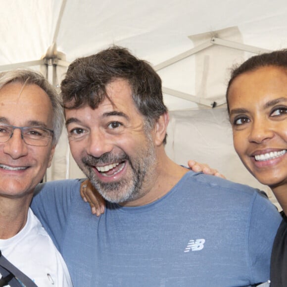 Laurent Petitguillaume, Stephane Plaza et Karine Le Marchand lors des 20 kilomètres de Paris, une course sur route de 20 kilomètres dont le départ est donné au Pont d'Iena au pied de la Tour Eiffel à Paris, France, le 13 octobre 2019. Photo par Loic Baratoux/ABACAPRESS.COM