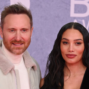 Ses followers sont conquis par ce beau moment de famille à bord d'un luxueux yacht.
David Guetta et sa compagne Jessica Ledon au photocall de la soirée des BRIT Awards 2022 à l'O2, Peninsula Square de Londres, Royaume Uni, le 8 février 2022. 