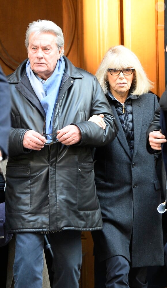 Alain Delon et Mireille Darc - Hommage a Georges Lautner en l'eglise Saint-Roch a Paris. Le 5 decembre 2013