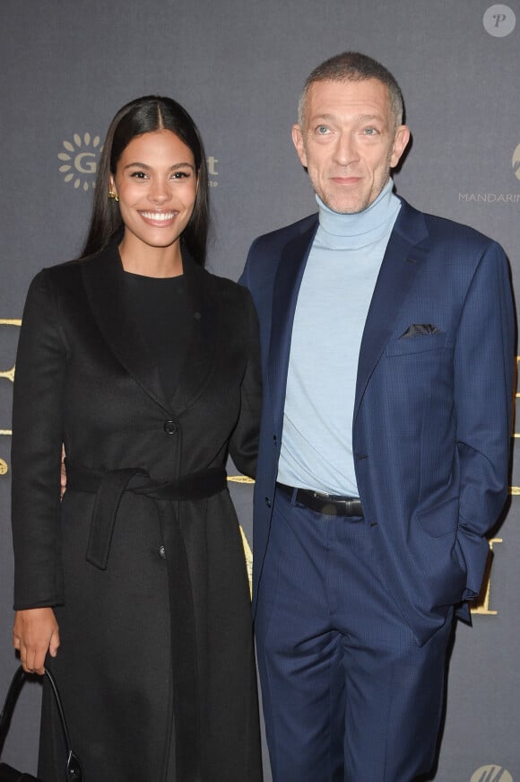 La troisième, Amazonie, est née de son amour avec la mannequin brésilienne Tina Kunakey
Vincent Cassel et sa femme Tina Kunakey à l'avant-première du film policier "L'Empereur de Paris" au cinéma Gaumont-Opéra à Paris, France, le 10 décembre 2018.