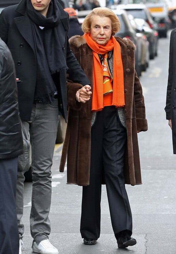 Liliane Bettencourt et son petit fils Jean-Victor Meyers quittent le restaurant du Bristol a Paris le 21 fevrier 2013.