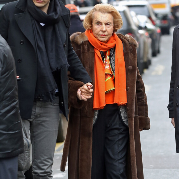 Liliane Bettencourt et son petit fils Jean-Victor Meyers quittent le restaurant du Bristol a Paris le 21 fevrier 2013.