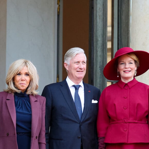 Pour l'occasion Brigitte Macron a accordé les couleurs de sa tenue à celle de la reine Mathilde dans des teintes de rouge
 
Brigitte Macron, le roi Philippe de Belgique, la reine Mathilde au palais de l'Elysée à Paris le 14 octobre 2024. Le couple royal de Belgique démarre une visite d'état de trois jours en France. © Dominique Jacovides / Bestimage