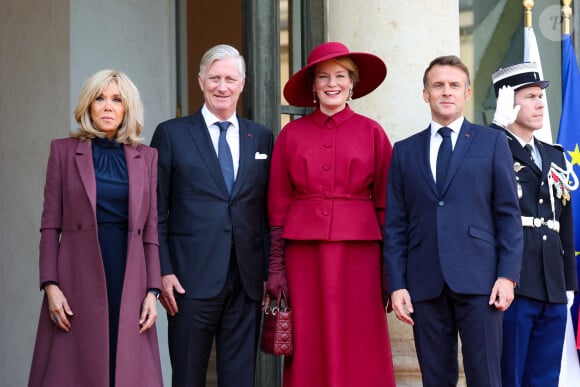 Brigitte Macron, le roi Philippe de Belgique, la reine Mathilde, le président Emmanuel Macron au palais de l'Elysée à Paris le 14 octobre 2024. Le couple royal de Belgique démarre une visite d'état de trois jours en France. © Dominique Jacovides / Bestimage