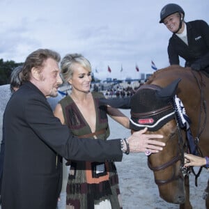 Johnny Hallyday, sa femme Laeticia Hallyday - Remise du Prix Eiffel avec Johnny et Laeticia Hallyday - Record du saut en hauteur de la ville de Paris / EOS - Longines Paris Eiffel Jumping à la plaine de Jeux de Bagatelle à Paris le 1er juillet 2016. © Olivier Borde / Veeren / Bestimage