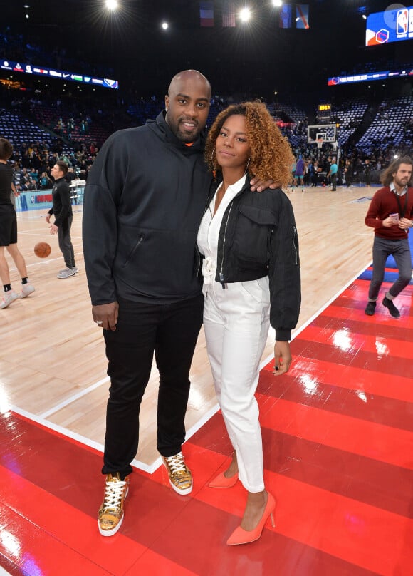 Teddy Riner et sa compagne Luthna Plocus au match de NBA Game Paris 2020 entre les Bucks de Milwaukee et les Charlotte Hornet à l'AccorHotels Arena à Paris le 24 janvier 2020. © Veeren / Bestimage