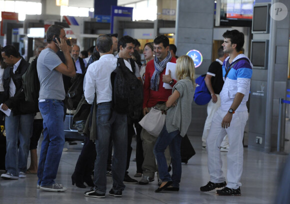 Les candidats se préparent à embarquer (30 juillet 2010 à l'aéroport de Roissy)