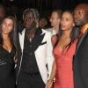 Bakary Sagna, William Gallas et leurs compagnes, à l'occasion du défilé du créateur Ozwald Boateng, lors de la Fashion Week londonienne, le 22 septembre 2010.