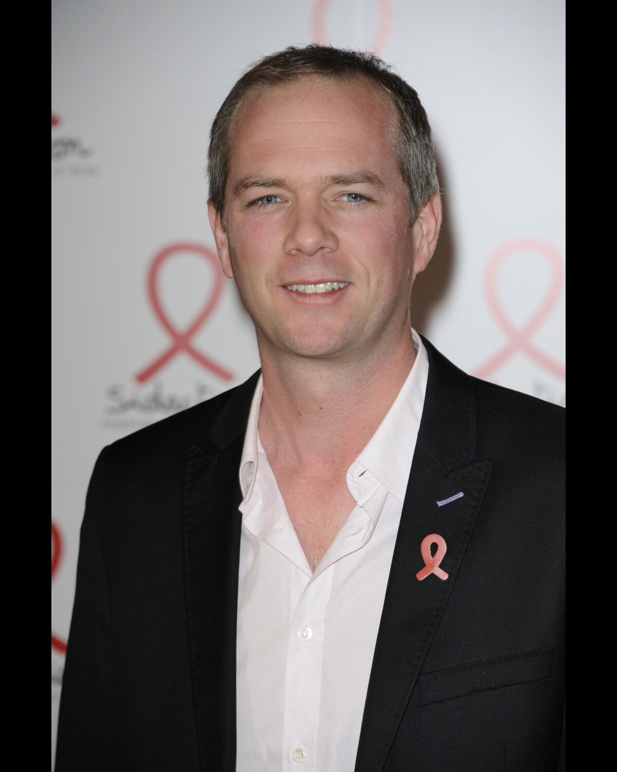 Photo Julien Arnaud lors du photocall pour la soirée du Sidaction 2011 au Musée du quai Branly