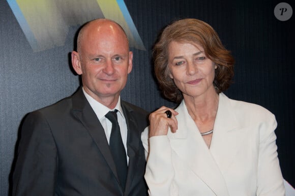 Christophe Girard et Charlotte Rampling lors de l'avant-première de Polisse dans le cadre du Festival Paris Cinéma le 30 juin 2011