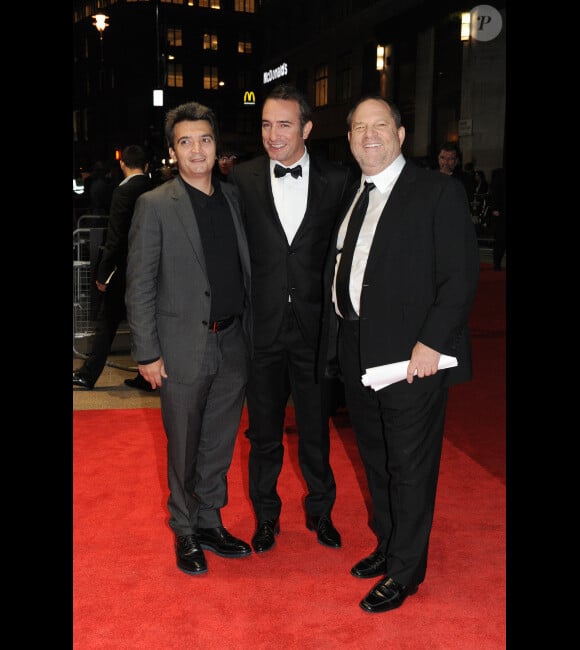 Thomas Langmann, Jean Dujardin et Harvey Weinstein à Londres le 18 octobre 2011 pour présenter The Artist.