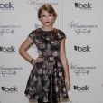 Taylor Swift, rayonnante dans sa robe Ted Baker, pour la présentation de son parfum. Nashville, le 27 octobre 2011. 