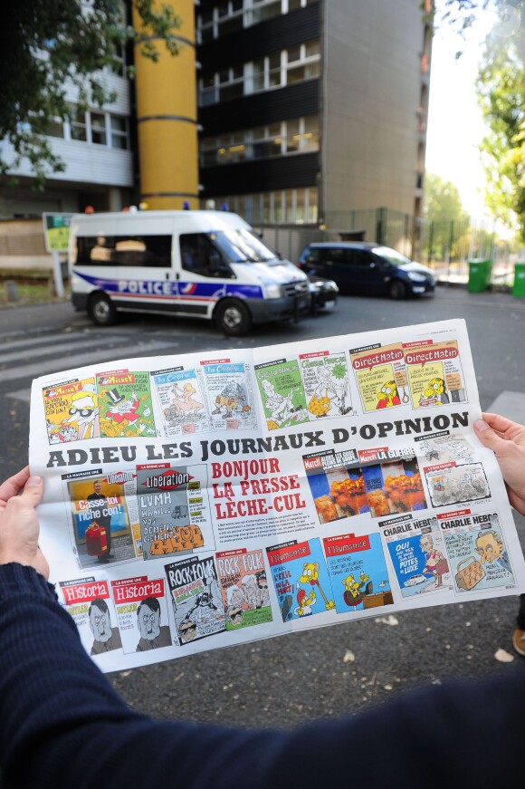 French satirical weekly Charlie Hebdo pictured in front the headquarters near a police car, Paris, France on September 19, 2012 the last issue which features on the front cover a satirical drawing entitled "Intouchables 2". Inside pages contain several cartoons caricaturing the Prophet Mohammed. Photo by Mousse/ABACAPRESS.COM19/09/2012 - Paris