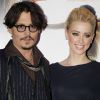 Johnny Depp et Amber Heard présentent Rhum Express, le 8 novembre 2011, à Paris.