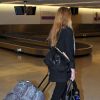 Whitney Port recharge son portable à l'aéroport de Miami, le 20 janvier 2012