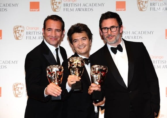 Jean Dujardin, Thomas Langmann et Michel Hazanavicius, lors des BAFTAs 2012, le 12 février à Londres.
