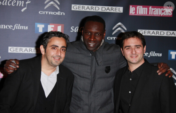 Eric Toledano, Omar Sy et Olivier Nakache lors de la soirée de remise des Trophées du Film français à Paris le 14 février 2012