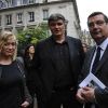 David Douillet, sa femme et Jean-François Lamour lors des obsèques de Thierry Roland le 21 juin 2012 en l'église Sainte-Clotilde à Paris
