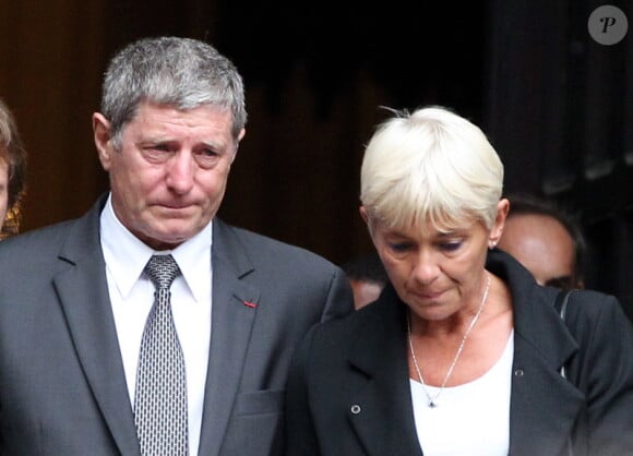 Jean-Michel Larqué et sa femme lors des obsèques de Thierry Roland le 21 juin 2012 en l'église Sainte-Clotilde à Paris