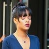 Rihanna (superbe en robe bleue et en chaussures Cédric Charlier) semble au bord des larmes au moment de quitter son hôtel le Gansevoort pour se rendre à l'enterrement de sa grand-mère Dolly. New York, le 6 juillet 2012.