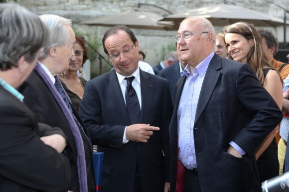 François Hollande et son ministre du Travail et ami Michel Sapin en Avignon, le 15 juillet 2012.