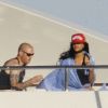Rihanna découvre en compagnie d'un ami son yacht le Latitude en Sardaigne le 15 juillet 2012
