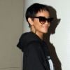 Rihanna, habillée d'un sweater Trapstar d'un legging noir et de baskets Nike Air Yeezy 2, arrive à l'aéroport de Los Angeles. Le 10 septembre 2012.