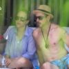 Robert Downey Jr. et son épouse Susan se relaxent au bord d'une piscine, à Miami, le 30 septembre 2012.