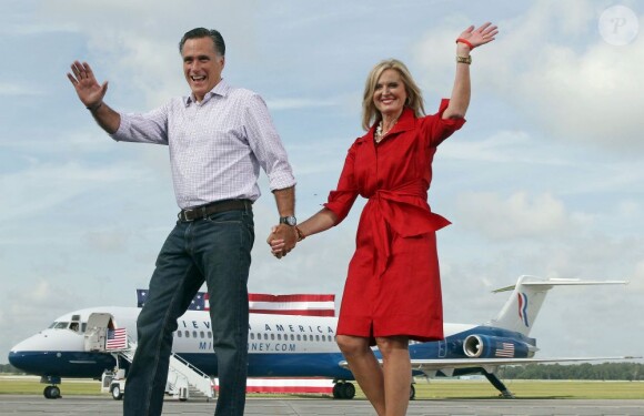 Republican presidential nominee Mitt Romney and his wife Ann, right, wave to cheering supporters as they take the stage at a send-off rally on the tarmac at the airport in Lakeland, FL, USA, Friday, August 31, 2012. After the Lakeland event, Romney was slated to fly to New Orleans to tour hurricane damage. Photo by oe Burbank/Orlando Sentinel/MCT/ABACAPRESS.COM01/09/2012 - Lakeland