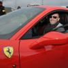 Fabien Barthez, tout sourire au moment de prendre le volant d'une Ferrari pour l'association les GT du coeur qui proposait des baptêmes au profit du Téléthon à Carcassonne le 2 décembre 2012