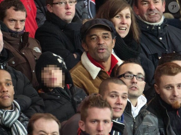 Yannick Noah et son fils Joalukas lors du match entre le PSG et Evian Thonon Gaillard au Parc des Princes à Paris le 8 décembre 2012 à Paris (victoire du PSG 4-0)