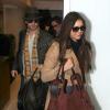 Nina Dobrev et Ian Somerhalder à l'aéroport de Los Angeles, le 26 décembre 2012. Le couple s'envole pour la Chine.