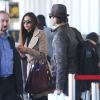 Nina Dobrev et Ian Somerhalder à l'aéroport de Los Angeles, le 26 décembre 2012. Le couple s'envole pour la Chine.