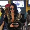 Nabilla à l'aéroport à Roissy Charles de Gaulle le 14 janvier 2013 pour participer à la saison 5 des Anges de la télé-réalite à Miami.