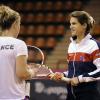 Amélie Mauresmo et Pauline Parmentier  lors d'un entraînement de l'équipe de France de Fed Cup à Limoges le 7 février 2013