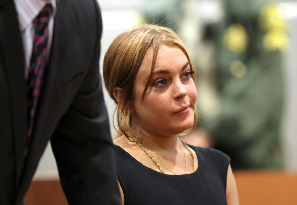 Lindsay Lohan et son avocat Mark Heller au tribunal de Los Angeles, le 30 janvier 2013. Le procès a été repoussé au 18 mars 2013.