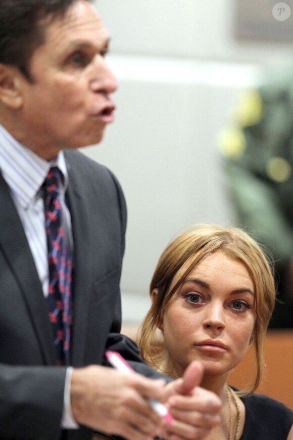 Lindsay Lohan et son avocat Mark Heller au tribunal de Los Angeles, le 30 janvier 2013. Le procès a été repoussé au 18 mars 2013.