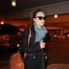 Olivia Wilde arrive de New York à l'aéroport de Los Angeles, le 24 mars 2013.