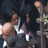 Sortie d'église lors des obsèques de Gérald Babin (candidat de Koh Lanta), à Nemours, le vendredi 5 avril 2013 - Sa compagne Leila, avec l'écharpe violette, est effondrée