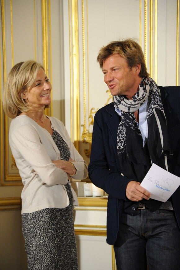 Claire Chazal et son complice d'un jour Laurent Delahousse à la conférence de presse de l'opération La Flamme Marie Claire à l'hôtel le Marois à Paris, le 16 mai 2013.