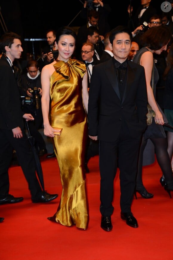 Tony Leung et Carina Lau lors de la montée des marches du Palais des Festivals à Cannes, le 17 mai 2013.