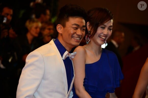 Meng Li et Baoqiang Wang lors de la montée des marches du Palais des Festivals à Cannes, le 17 mai 2013.