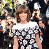 Milla Jovovich arrive pour la montée des marches du film Blood Ties au Palais des Festivals, durant le 66e Festival de Cannes, le 20 mai 2013