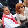 Gerard Holtz et son épouse Muriel Mayette lors de Roland-Garros le 1er juin 2013.