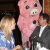 Laurent Gerra et sa compagne Christelle avec Christophe Beaugrand déguisé en cochon à la soirée "La charcuterie fait son show" au Chalet du Lac à Paris le 10 juin 2013.