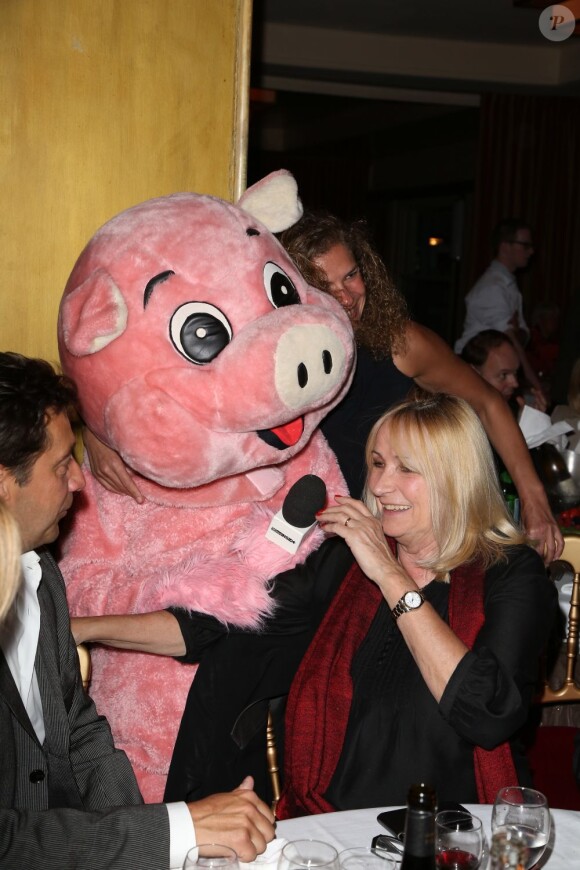 Julie Leclerc, Christophe Beaugrand déguisé en cochon à la soirée "La charcuterie fait son show" au Chalet du Lac à Paris le 10 juin 2013.